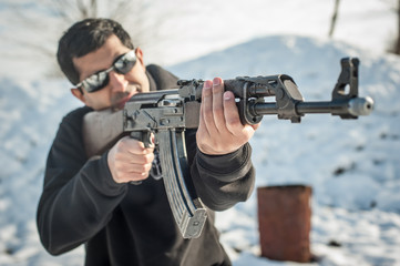 Front view gun point riffle machine gun. Shooting and weapons