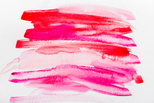 Top View Of Pink And Red Brushstrokes On White Paper