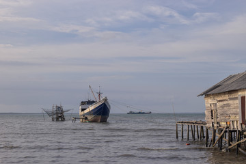 Fototapeta na wymiar old fishing boat on the beach