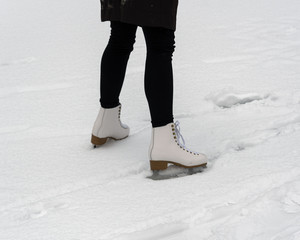Girl skating on the ice surface.
