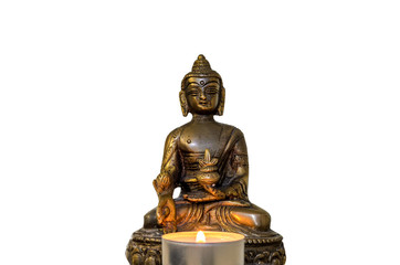 Buddha statue with burning candles isolated on white background
