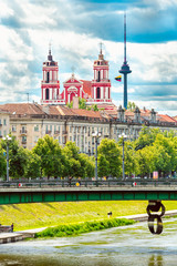 River Neris and Green Bridge. In the distance - Church of St. James and St. Phillip and Vilnius TV...