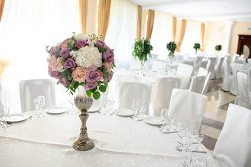 Beautiful flowers composition on table in wedding day