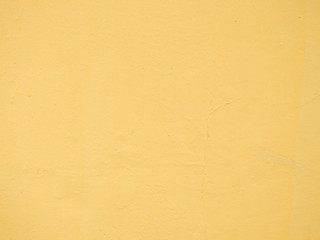 Ocher, dark yellow concrete wall background texture