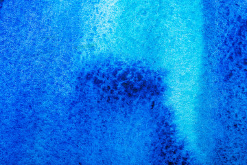 top view of blue watercolor spill with copy space