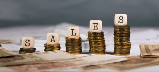 Word SALES composed of wooden letter.