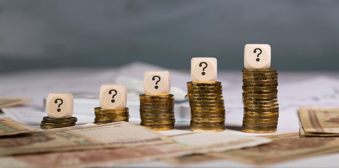 Sign of quiestion mark on stakes of coins