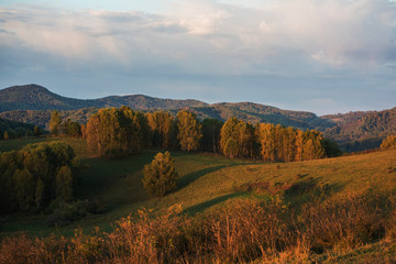Naklejka na ściany i meble Beauty sunrise in the mountains in Altay, beauty warm september day