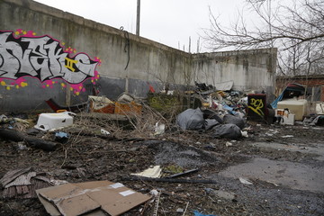  Environmental problems and nature pollution. Waste dumped in the city, an illegal social issue. Rubbish, garbage, outdoor, city, landscape, city space, abandoned