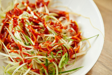 Sliced spring onion with chili sauce