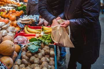 Shopping with eco shopper bag at street market