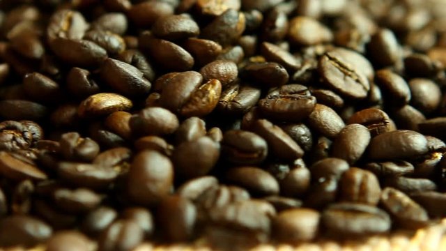 Pile of coffee beans on the table, close up in studio