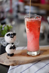 glass of drink on wooden table