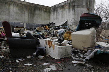 Environmental problems and nature pollution. Waste dumped in the city, an illegal social issue. Rubbish, garbage, outdoor, city, landscape, city space, abandoned