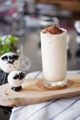 glass of drink on wooden table