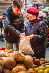 Shopping with eco shopper bag at street market