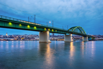 Belgrade, Serbia - February 10, 2019: Old railway bridge across the Sava River at dusk