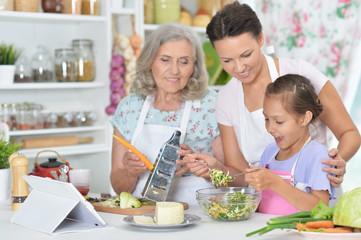 Portrait of smiling happy family cooking together