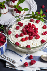 Curd-chocolate dessert without sugar with fresh raspberries and mint. Healthy eating. The concept of a healthy diet.