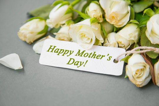 Happy Mother's Day greeting with white tulips bouquet