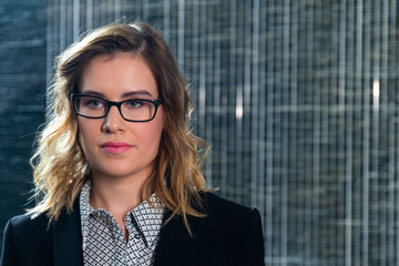 Portrait shot of a young business woman in a modern office.