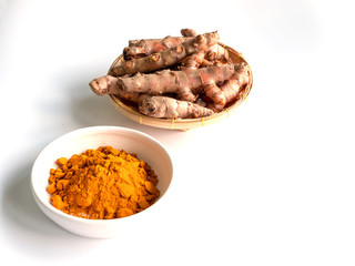 Turmeric powder and turmeric isolated white background.
