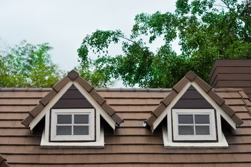 Window on second floor of home.