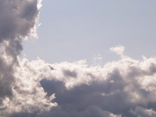 Photo of dark clouds on blue sky.