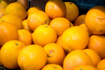 fresh citrus fruits are on the counter in the store