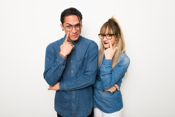 Fototapeta premium Young couple with glasses looking to the front