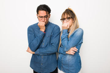 Young couple with glasses having doubts