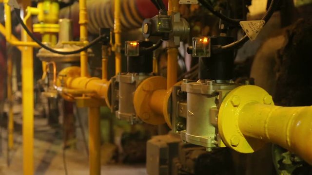 yellow gas pipes in the boiler room