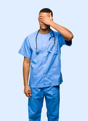 Surgeon doctor man covering eyes by hands. Do not want to see something on isolated background