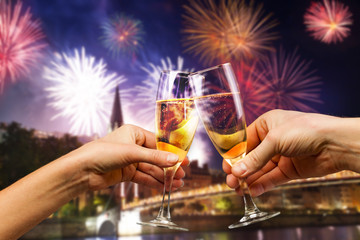Celebration and firework with glasses of champagne