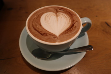 A cup of coffee with heart symbol