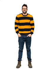 Naklejka premium Full-length shot of Handsome man with striped sweater with glasses and happy on isolated white background