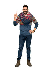Full-length shot of Hippie man showing and lifting a finger in sign of the best on isolated white background