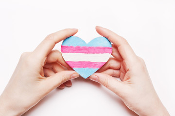 Heart color flag transgender in hand.