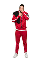 Full-length shot of Handsome sportman is suffering with cough and feeling bad on isolated white background