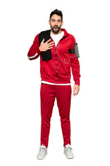 Fototapeta premium Full-length shot of Handsome sportman surprised and shocked while looking right on isolated white background
