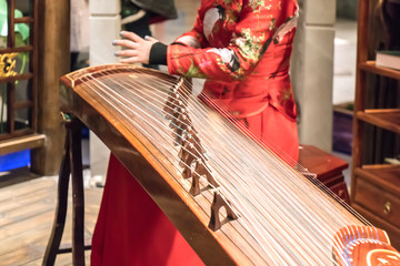 Women are playing zither, Chinese instruments