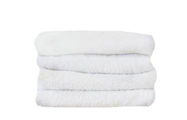 Stack of colorful bath towels  on white background.Pile of rainbow colored towels isolated.Top view.Hygiene, fabric,spa and textile concept.