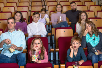 Number of people enjoying film screening and popcorn