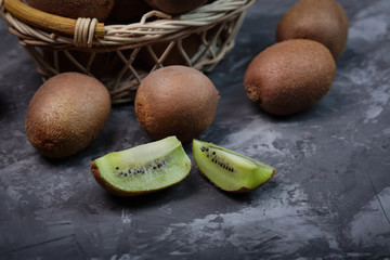 juicy ripe pieces of kiwi on a dark background
