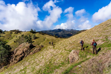 Fototapeta na wymiar Hikers along the hillside hiking