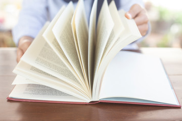 Women Muslim students studying and reading with books in  library, concept: Development of learning and education, workplace for knowledge outside the classroom, female young open textbook school 