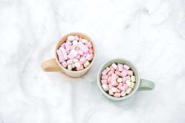 Fototapeta na wymiar Hot chocolate with marshmallow and candy cane sweets in cups for holiday