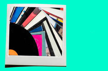 Instant photo on colored blue soft background.