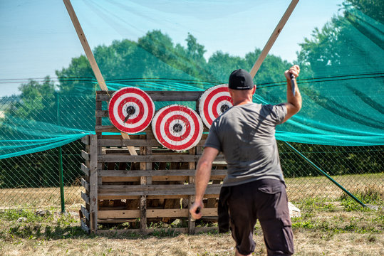 A man is ready for throwing knife to the target  on competition. on competition.