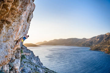 Climbing Sport fitness athlete on beautiful rocks. Active healthy sports lifestyle